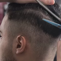 Man Getting A Haircut At Salon ManeTained in Granbury, Texas