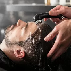 Man Getting his Hair cut and Beard Trimmed at ManeTained Salon for Men